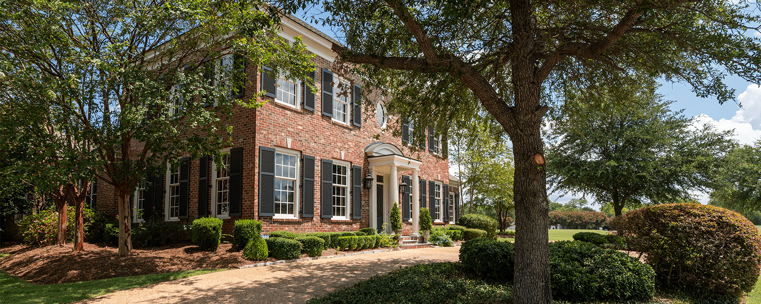 Dwell Shutter and Blinds Black louvered exterior shutters built by Dwell Shutter & Blinds.