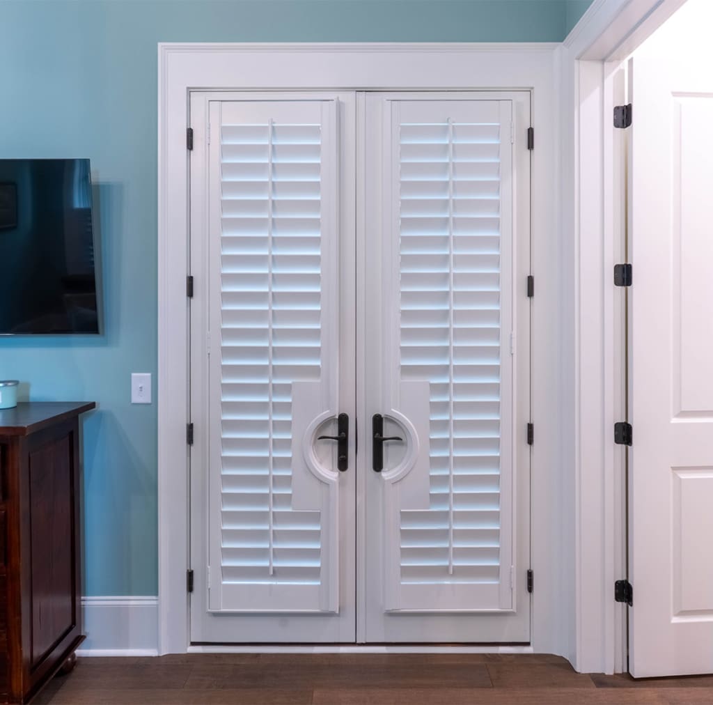 Moveable louvered doors built and installed by Dwell Shutter and Blinds
